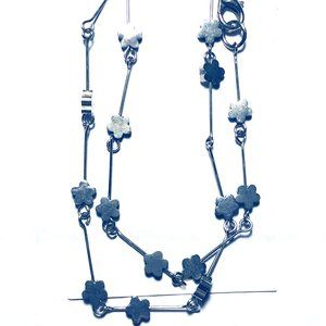 Metal flower on pins necklace